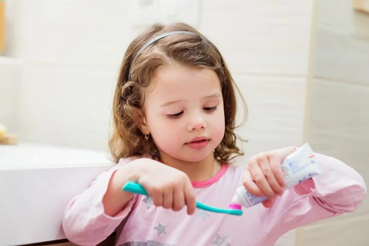 Child brushing their teeth as part of a bedtime routine
