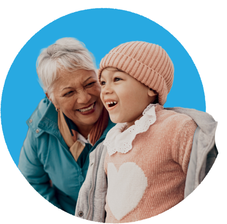 Grandparent laughing joyfully with a young child